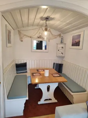 Ein Sitzbereich in der Unterkunft Ferienwohnung Timmestrand