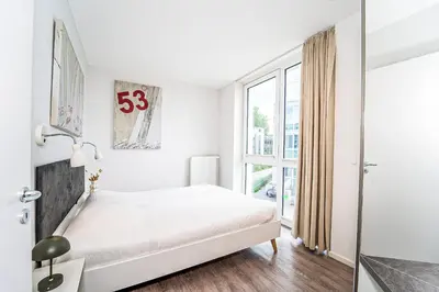 Ein Bett oder Betten in einem Zimmer der Unterkunft Promenadenvilla 03 Wohnung 04