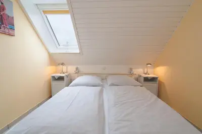 Ein Bett oder Betten in einem Zimmer der Unterkunft Ferienwohnung 