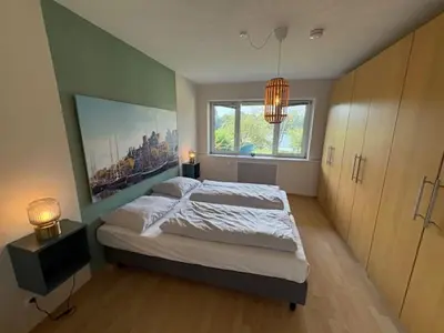 Ein Bett oder Betten in einem Zimmer der Unterkunft Aparthotel Am Mühlenteich