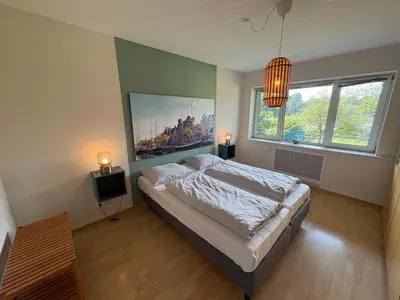 Ein Bett oder Betten in einem Zimmer der Unterkunft Aparthotel Am Mühlenteich