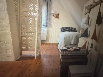 Ein Bett oder Betten in einem Zimmer der Unterkunft Kapitänshaus