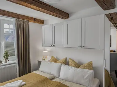 Ein Bett oder Betten in einem Zimmer der Unterkunft Objekt-Nr 241 - Hafen - Kurgartenstraße