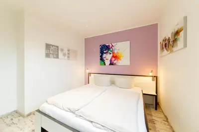 Ein Bett oder Betten in einem Zimmer der Unterkunft Ferienwohnung Logenplatz Timmendorfer Strand