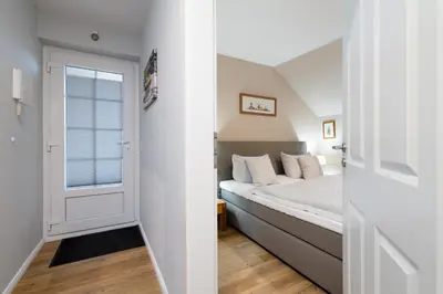 Ein Bett oder Betten in einem Zimmer der Unterkunft Gorch-Fock-Park Ferienwohnung 