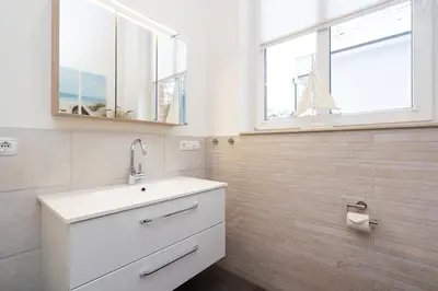 Ein Badezimmer in der Unterkunft Strandperle No 22