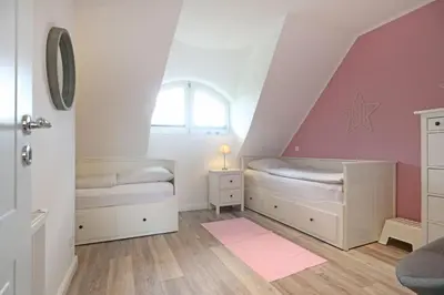Ein Bett oder Betten in einem Zimmer der Unterkunft Meerzeit Doppelhaushälfte