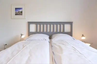 Ein Bett oder Betten in einem Zimmer der Unterkunft Haus SeeZeit Appartement 06