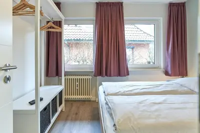 Ein Bett oder Betten in einem Zimmer der Unterkunft Haus SeeZeit Appartement 04