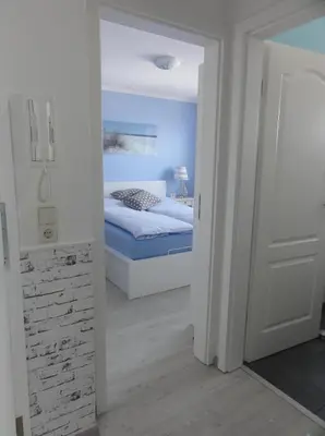 Ein Bett oder Betten in einem Zimmer der Unterkunft Strandschlösschen Utkiek