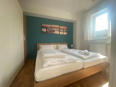 Ein Bett oder Betten in einem Zimmer der Unterkunft Tümmler