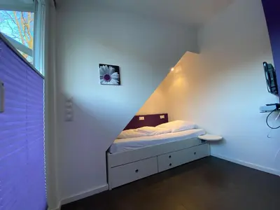 Ein Bett oder Betten in einem Zimmer der Unterkunft Flipper