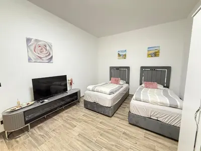 Ein Bett oder Betten in einem Zimmer der Unterkunft Moderner Neubau nähe Lübeck