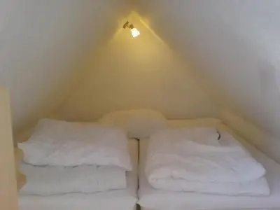 Ein Bett oder Betten in einem Zimmer der Unterkunft Apartment 3 by Interhome