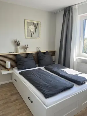 Ein Bett oder Betten in einem Zimmer der Unterkunft Ferienwohnung Larila Timmendorfer Strand