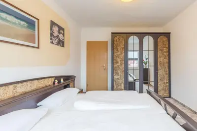 Ein Bett oder Betten in einem Zimmer der Unterkunft Ferienwohnung Erika
