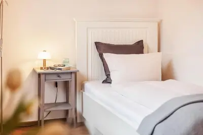 Ein Bett oder Betten in einem Zimmer der Unterkunft Gästehaus Daheim - Studio 01