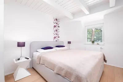 Ein Bett oder Betten in einem Zimmer der Unterkunft Strandhus Kapitän