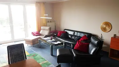Ein Sitzbereich in der Unterkunft Strandallee 50, Ferienwohnung mit direktem Meerblick