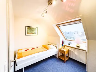 Ein Bett oder Betten in einem Zimmer der Unterkunft TraveNah