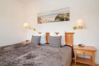 Ein Bett oder Betten in einem Zimmer der Unterkunft Gästehaus Nina #4