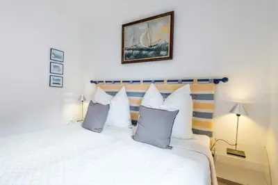 Ein Bett oder Betten in einem Zimmer der Unterkunft Domizil Strandburg App 6