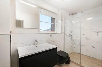 Ein Badezimmer in der Unterkunft SunSide Apartment #2