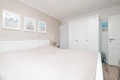 Ein Bett oder Betten in einem Zimmer der Unterkunft Seeschwalbennest
