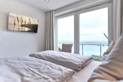 Ein Bett oder Betten in einem Zimmer der Unterkunft Sea View Suite