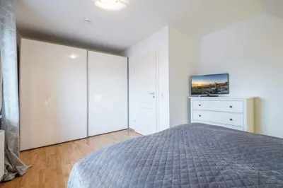 Ein Bett oder Betten in einem Zimmer der Unterkunft Baltica