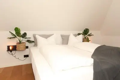 Ein Bett oder Betten in einem Zimmer der Unterkunft Reethüs am Schlossgut