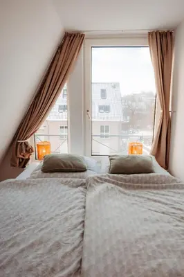 Ein Bett oder Betten in einem Zimmer der Unterkunft Ferienwohnung Wirbelwind