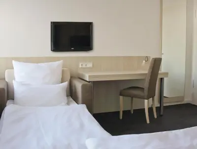 Ein Bett oder Betten in einem Zimmer der Unterkunft Viva Hotel Lübeck
