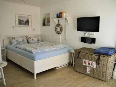 Ein Bett oder Betten in einem Zimmer der Unterkunft Strandperle 3
