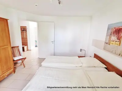 Ein Bett oder Betten in einem Zimmer der Unterkunft Apartmentvermittlung Mehr als Meer - Objekte 42 & 51