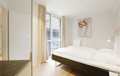 Ein Bett oder Betten in einem Zimmer der Unterkunft Priwallpromenade 2, Whg 3