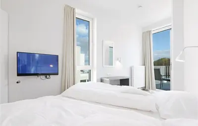Ein Bett oder Betten in einem Zimmer der Unterkunft Priwallpromenade 2, Whg 10