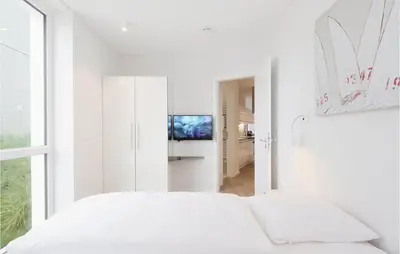 Ein Bett oder Betten in einem Zimmer der Unterkunft Priwallpromenade 3, Whg 3