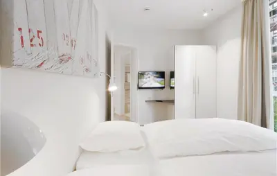 Ein Bett oder Betten in einem Zimmer der Unterkunft Priwallpromenade 27, Whg 2