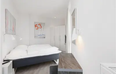 Ein Bett oder Betten in einem Zimmer der Unterkunft Priwallpromenade 29, Whg 19