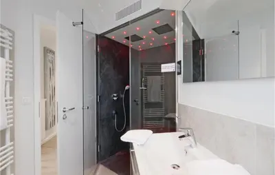 Ein Badezimmer in der Unterkunft Dünenvilla 1, Whg 2