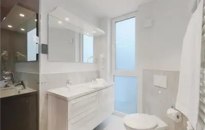 Ein Badezimmer in der Unterkunft Dünenvilla 1, Whg 4