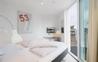 Ein Bett oder Betten in einem Zimmer der Unterkunft Dünenvilla 9, Whg 3
