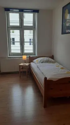Ein Bett oder Betten in einem Zimmer der Unterkunft 2-Zimmer-Ferienwohnung im 1. Obergeschoss