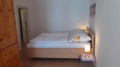 Ein Bett oder Betten in einem Zimmer der Unterkunft 2-Zimmer-Ferienwohnung im 1. Obergeschoss