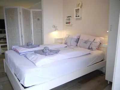 Ein Bett oder Betten in einem Zimmer der Unterkunft Strandperle 5