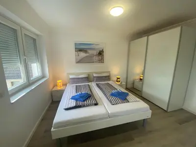 Ein Bett oder Betten in einem Zimmer der Unterkunft Haus Regina
