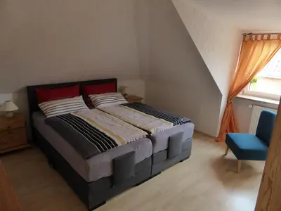 Ein Bett oder Betten in einem Zimmer der Unterkunft Ferienwohnung Haus Rita