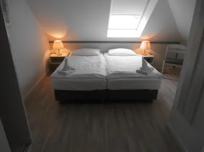 Ein Bett oder Betten in einem Zimmer der Unterkunft Haus Südstrand 09, Panoramameerblick