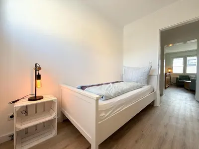 Ein Bett oder Betten in einem Zimmer der Unterkunft Gästehaus Passat